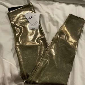 Heroinesport gold shiney marvel legging